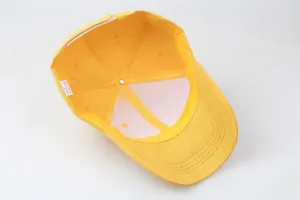 Detailed interior of yellow cotton baseball cap with six-panel stitching and white sweatband