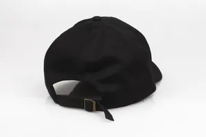 Black cotton baseball cap for couples featuring King and Queen embroidery and adjustable metal strap