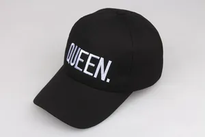 Detailed view of high-quality white Queen embroidery on black cotton baseball cap