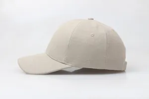 Detailed side view of beige cotton baseball cap showing twill fabric and stitching