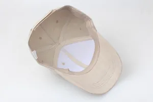 Inner structure of a beige cotton baseball cap with sweatband and reinforced panels