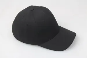 Close-up of a plain black cotton baseball cap with classic six-panel structure