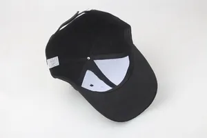 Detail view of cotton baseball cap interior featuring sweatband, lining and washing label