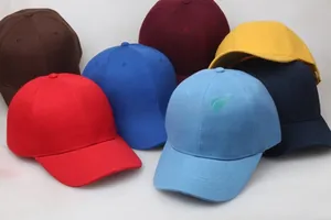 Detailed stacked view of six-panel cotton baseball caps in various vibrant solid colors
