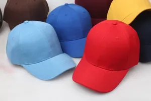 Detail view of colorful cotton twill baseball caps showing fabric texture and vibrant colors