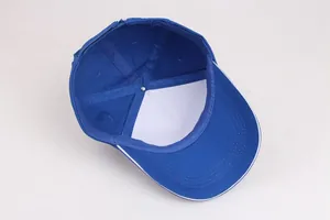 Detail view of cotton baseball cap interior showing reinforced seams and blue brim