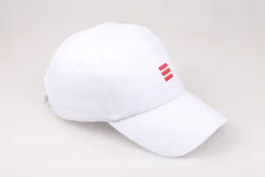 Detail of white cotton baseball cap featuring three red stripes and curved visor