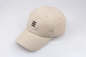 Detail of beige baseball cap featuring three black horizontal embroidered stripes