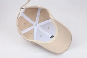 Detailed internal view of cotton baseball cap featuring reinforced seams and adjustable strap