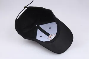 Detail view of cotton baseball cap interior featuring six-panel structure and metal buckle