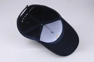 Inside view of navy cotton baseball cap showing internal structure and star embroidery