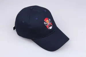 Detail shot of navy cotton baseball cap featuring intricate Chinese opera mask embroidery