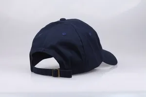 Navy blue cotton baseball cap featuring classic six-panel design and adjustable metal buckle