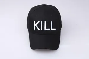 Detail view of black baseball cap featuring white bold KILL embroidery and premium cotton fabric
