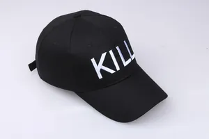 Close-up of the white KILL embroidery on a black cotton canvas baseball cap
