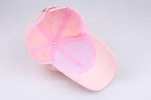 Detail view of pink baseball cap interior with reinforced seams and metal buckle adjustment