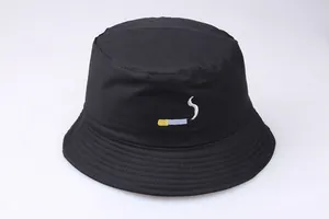 Detailed close-up of high-quality cigarette embroidery on a black cotton bucket hat