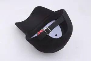 Close-up of black cotton baseball cap back with silver metal adjustable buckle and hidden rose embroidery