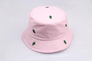 Close-up of pink cotton bucket hat with green cactus embroidery and sun protection brim