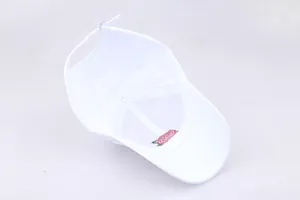 Detailed view of adjustable silver buckle and rose embroidery on white baseball cap