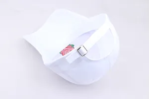Close-up of white baseball cap with adjustable silver buckle and rose embroidery detail