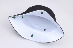 Close-up of reversible bucket hat with cactus embroidery and stitched cotton canvas brim