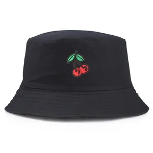 Black cotton bucket hat featuring red cherry embroidery and a classic flat top design