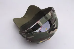 Detail view of camouflage baseball cap back with adjustable black velcro strap and lining