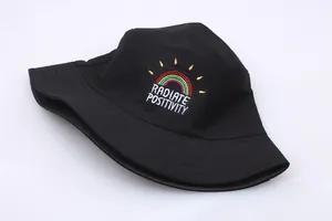 Detail of rainbow embroidery with Radiate Positivity text on black cotton bucket hat