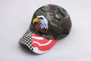 Detail of eagle embroidery and US flag pattern on the brim of a camouflage baseball cap