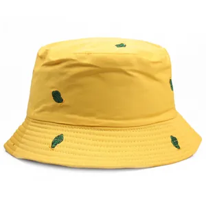 Bright yellow reversible bucket hat with green cactus embroidery for outdoor sun protection