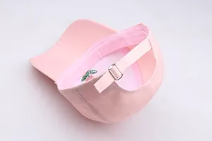 Detailed back view of pink cotton baseball cap featuring adjustable silver metal buckle