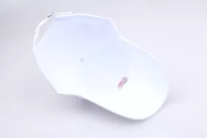 Detail view of white baseball cap interior with embroidery and adjustable metal buckle strap