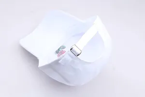 Close-up of white cotton baseball cap with adjustable metal buckle and rose embroidery