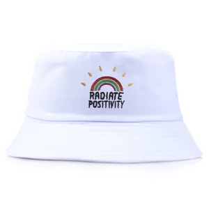 White cotton bucket hat featuring rainbow embroidery and Radiate Positivity text