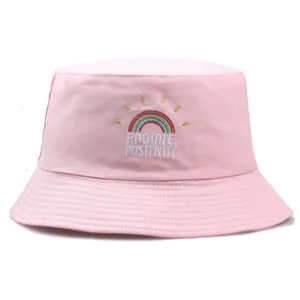 Pink cotton bucket hat with rainbow embroidery and Radiate Positivity text design