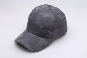 Macro detail of dark grey camouflage baseball cap showing stitching and breathable vents