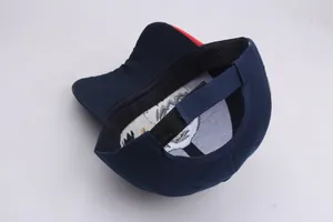 Detailed view of navy blue baseball cap interior and adjustable hook-and-loop strap