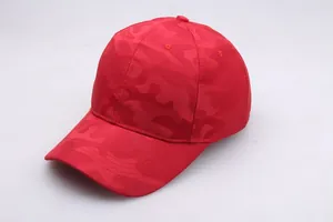 Detailed top view of red camouflage mesh fabric and stitched panels on the baseball cap