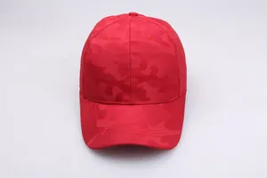 Macro shot of red camouflage pattern texture on a structured baseball cap fabric