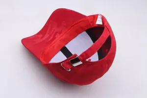 Detail view of red baseball cap with flame texture, sweatband and metal buckle
