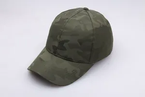 Detailed view of army green camouflage baseball cap with textured mesh fabric