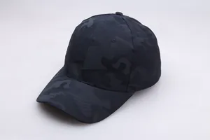 Close-up detail of dark blue camouflage baseball cap with breathable fabric texture