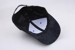 Internal view of baseball cap showing breathable mesh with camouflage pattern and buckle