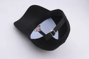Detail of embroidered watermelon baseball cap with adjustable metal buckle and strap