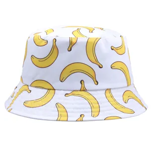Reversible white bucket hat with yellow banana print and reinforced brim stitching