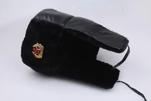 Insulated black aviator hat with faux fur lining and red star badge on a white background