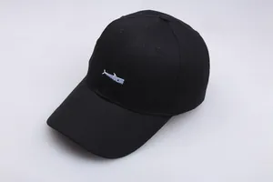 Detail of blue fish embroidery on black cotton baseball cap with six-panel structure
