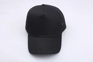 Detail view of the breathable mesh back and classic curved brim on a black cotton baseball cap