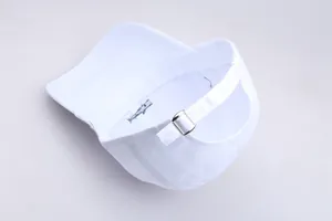 Detail of white cotton baseball cap showing adjustable silver buckle and blue fish embroidery